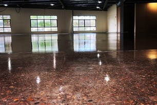 sealed flaked concrete flooring in large warehouse